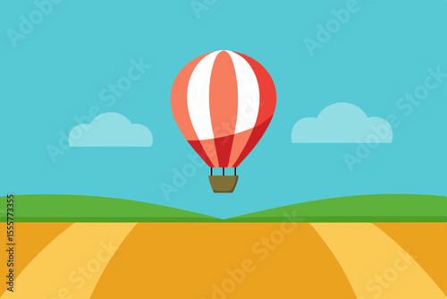 An aerial view from a hot air balloon floating above vast empty patchwork farm fields