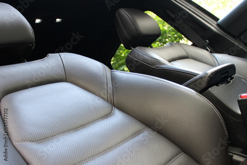 Leather active lateral and lumbar support rollers in a premium car. Comfort and convenience for long travel in business class car 