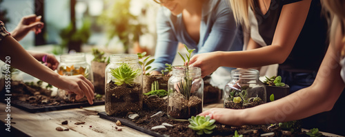 Participants enjoy a creative workshop in a cozy indoor space while assembling terrariums with various plants and decorations