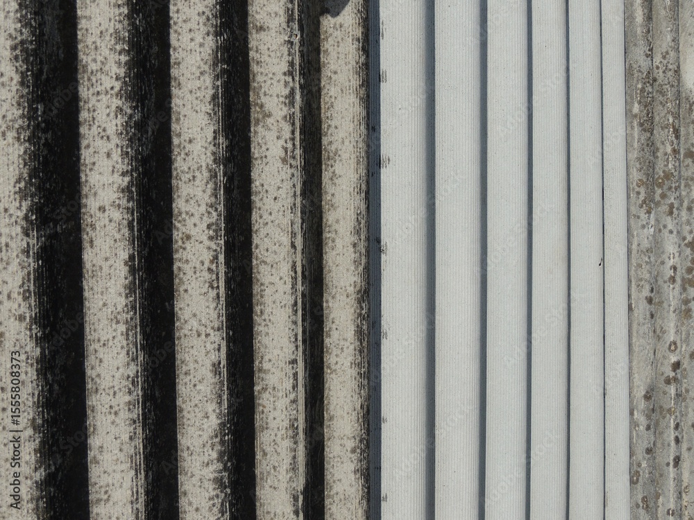 volumetric stripes of slate waves, side view, perspective of a corrugated sheet of covering material, a fence made of old slate sheets of different shades of gray, an angled view volumetric stripes of slate waves, side view, perspective of a corrugated sheet of covering material, a fence made of old slate sheets of different shades of gray, an angled view