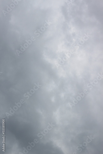 sky filled with dense, gray clouds. The clouds exhibit varying shades of gray and have a textured, layered appearance.