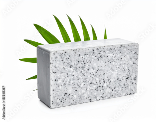 Grey Speckled Soap Bar with Green Palm Leaf on White Background