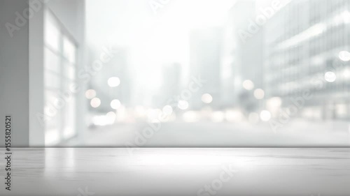The video's blurred background shows an interior space with a portion of a white wall and a window border.