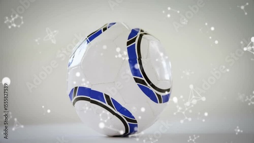 Molecular particles drifting around white ball with blue black accents rotating to reveal panels