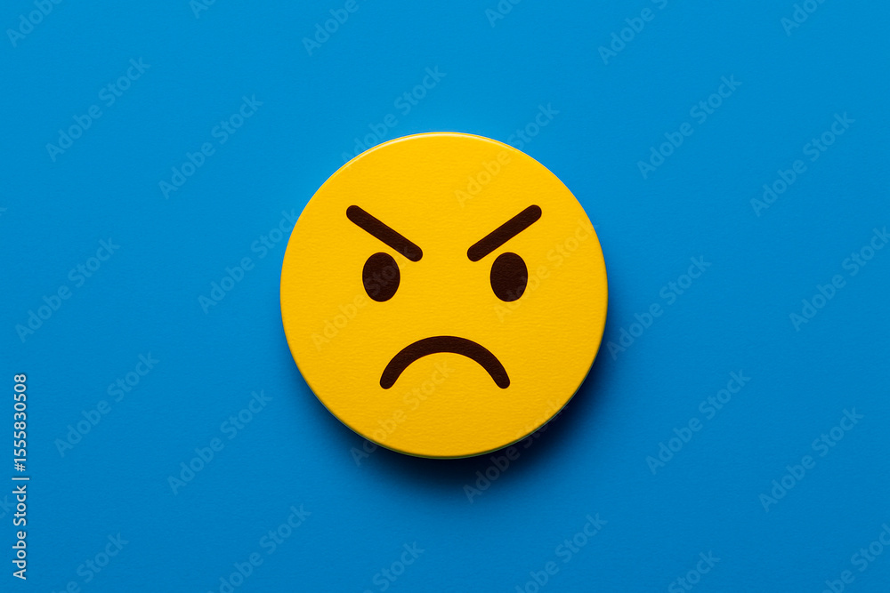 Fototapeta premium Round yellow painted circle with a sarcastic cartoon face on a bright blue background, symbolizing skeptical customer feedback or sarcastic team response for modern business communication visuals.