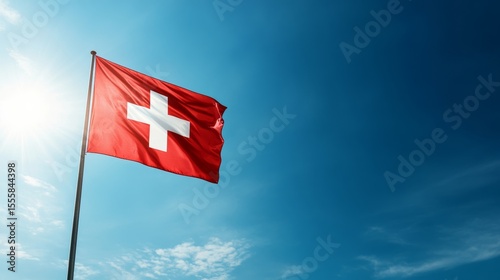 Bright red flag with white cross on a flagpole,