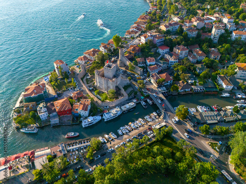 Anatolian Fortress Stunning Aerial View of a Coastal Town with Boats and a Bridge. High-angle, full shot of picturesque coastal town nestled beside waterway. Anadolu Hisari Bosphorus Istanbul Turkey