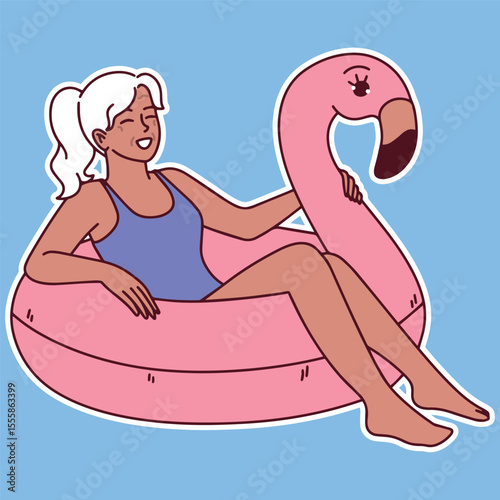 Dark skinned senior woman in swimsuit relaxes on inflatable flamingo in pool enjoying calm summer day