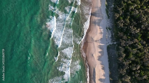 Aerial Reverse Reveal of Sunshine Beach, Queensland with Ocean, Forest and Sand in Frame
