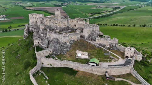 4K drone flying along the inner side of Slovak castle ruins, capturing courtyard and architectural details. No audio.
