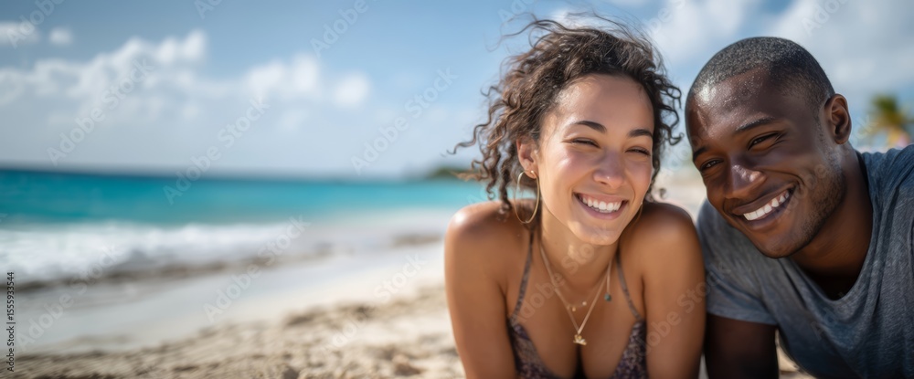 Obraz premium Happy young couple relaxing on beach