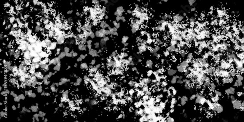 Snowflakes on dark background. white icy snowflakes isolated on black background, natural background. white crystalline powder on a black background. sugar dust. texture, pattern and clipping.