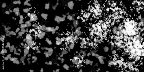 Snowflakes on dark background. white icy snowflakes isolated on black background, natural background. white crystalline powder on a black background. sugar dust. texture, pattern and clipping.