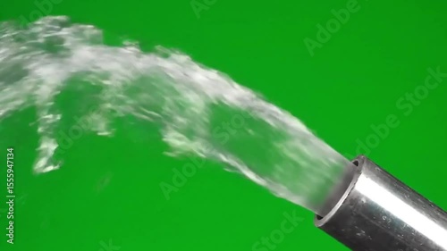 Water Jetting from a Metal Pipe Against a Green Screen