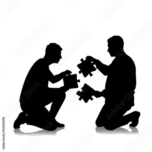 Two men assembling puzzle pieces together in silhouette  