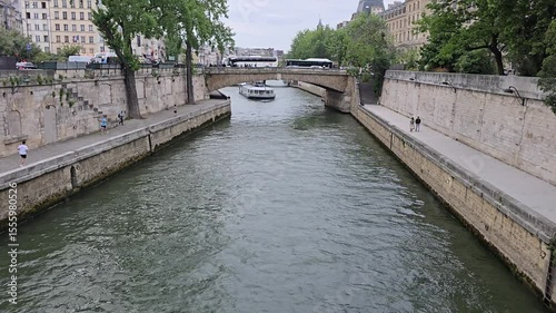 Paris, France. May 15, 2025, People enjoying walking along Canal Saint Martin in Paris