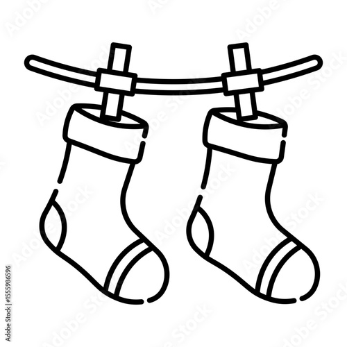 Made in UK Laundry day delight two socks drying on a clothesline vector icon outline style.