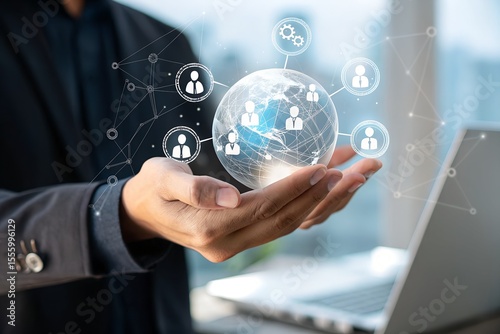 Businessman holding digital icons of people and team management, representing human resources, recruitment, employee data, business leadership, and digital HR solutions.