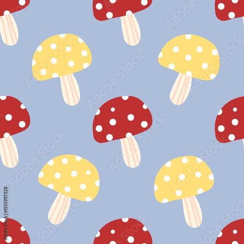 Colorful red and yellow mushrooms with white dots on blue background. Fun and quirky pattern perfect for fabric, kids design, and woodland themes.