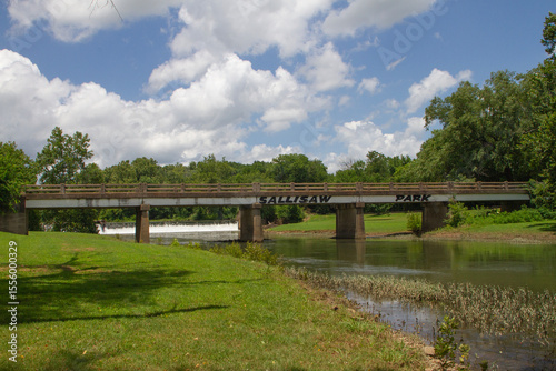Sallisaw Park in Oklahoma with stream, bridge and dam