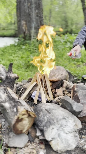 View of the fireplace, mountains, and lake.  Flames. Barbecue stones. Warming up by the fire. Mountain romance.