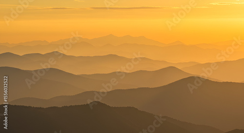 Wallpaper Mural Layers of Golden Mountain Ridges at Sunset: A Serene and Majestic Vista Torontodigital.ca