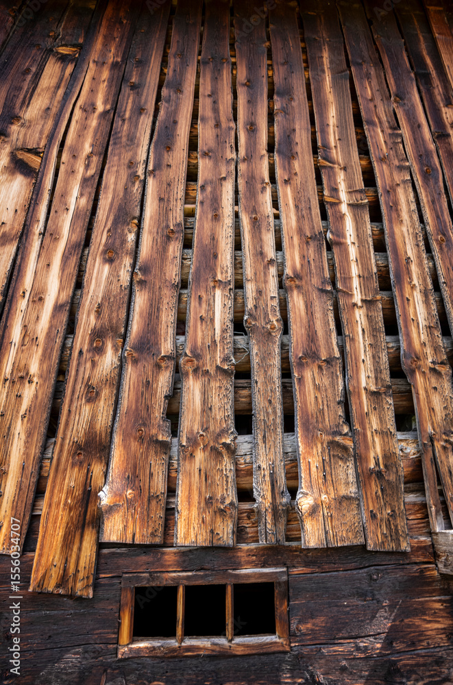 Obraz premium Close-up of the wooden planks of an old barn in the Swiss village of Sedrun