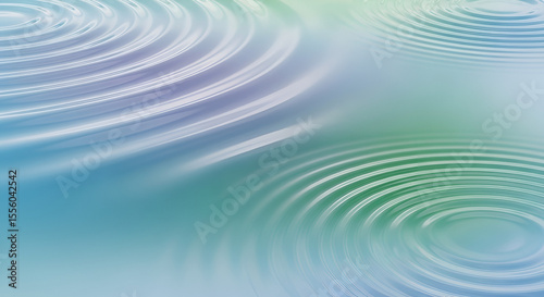 Mesmerizing concentric ripples gently expand across a tranquil surface, creating a captivating display of fluid motion and soft, pastel color gradients