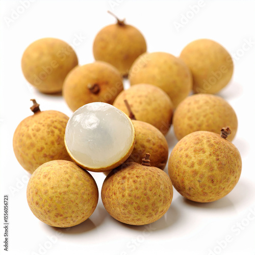 the image showcases a collection of small, round, tan colored fruits, clustered together on a plain white surface