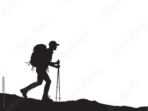 Silhouette of a hiker with backpack and poles on a mountain ridge