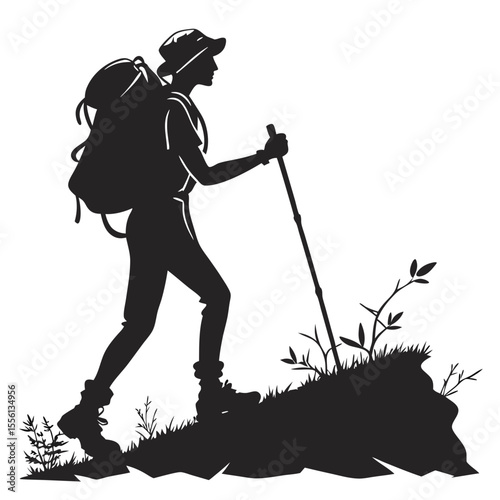 Black silhouette of a hiker with a backpack and trekking pole walking on a rocky path with sparse vegetation
