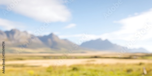 Blurred landscape with mountains and fields