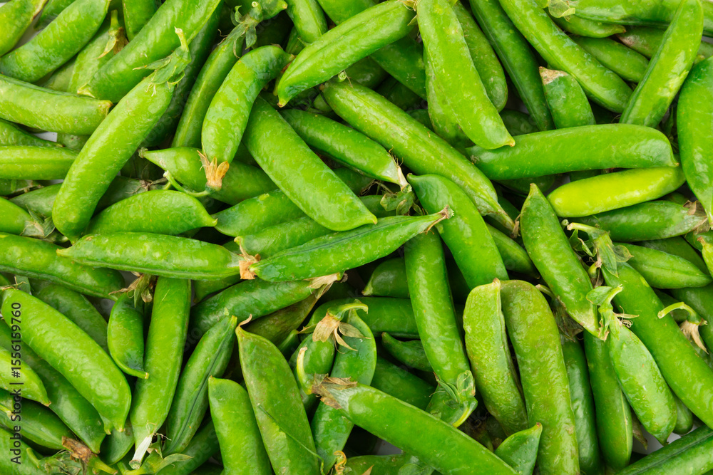 Fresh green pea pods with green peas isolated on white background. Sweet green peas. Green pea beans vegetables. Vegan. healthy vegetable Fresh green pea pods with green peas isolated on white background. Sweet green peas. Green pea beans vegetables. Vegan. healthy vegetable