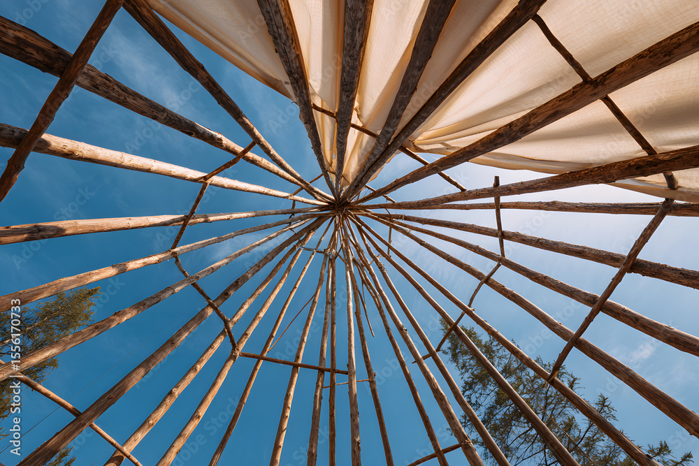 Fototapeta premium Traditional native teepee frame, bottom up view, wide angle.