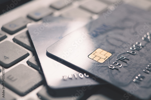 a closeup shot of a credit card with a black keyboard