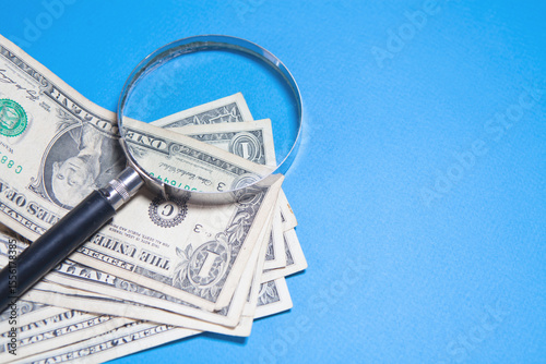 money in the magnifying glass