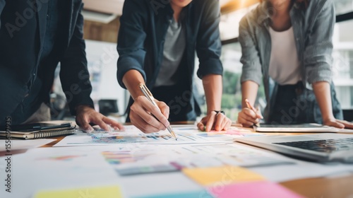 Business Team Collaborating on Financial Reports in Office Setting