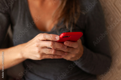 woman holding cell phone