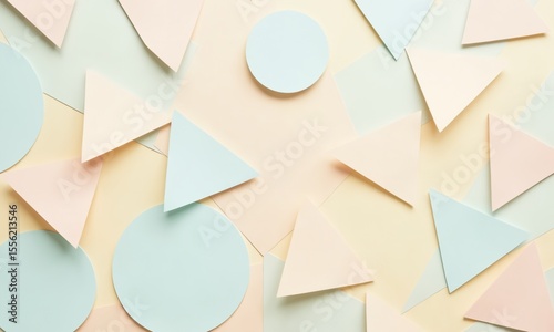 A dynamic arrangement of pastel paper triangles and circles, forming a rhythmic and soothing abstract pattern.