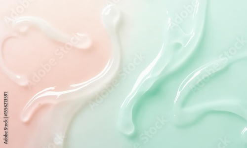 Delicate swirls of translucent skincare gel in blush and mint tones, creating a serene and refreshing visual.
