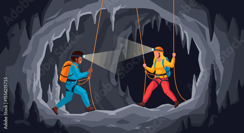 Two spelunkers explore a vast cave with stalactites and ropes