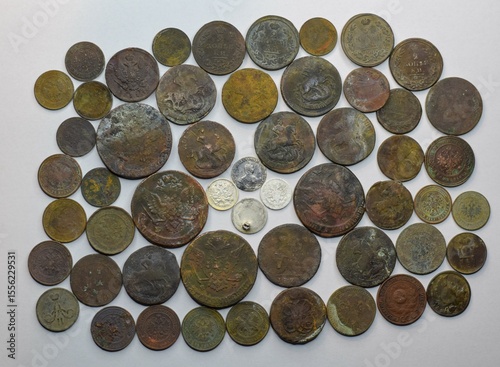 A lot of old coins on white background