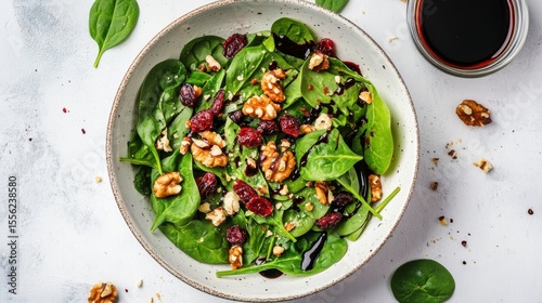 Freshness in a Bowl: An overhead shot showcases a vibrant and wholesome salad, brimming with a colorful mix of fresh ingredients, presenting a culinary delight in its natural, inviting appeal.