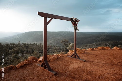 Wooden wedding arbour on Perth Hills lookout with flowers for rustic elopement wedding