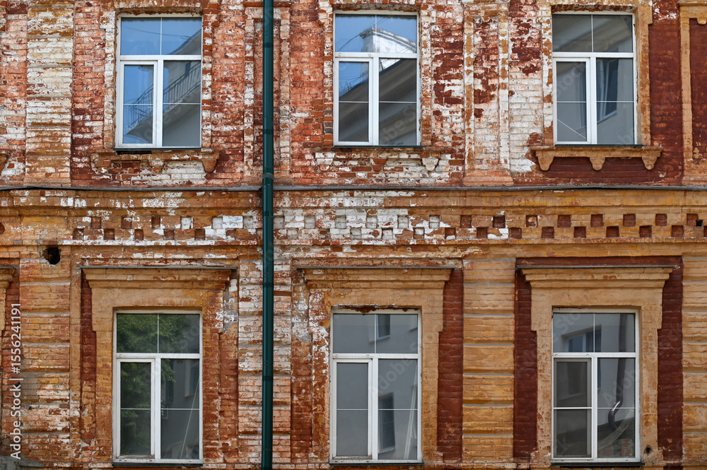 Fototapeta premium Fragment of old building with and windows