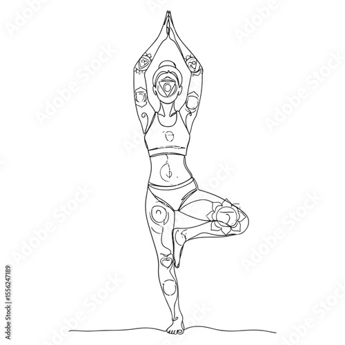 Woman in yoga tree pose with chakra symbols vrikshasana