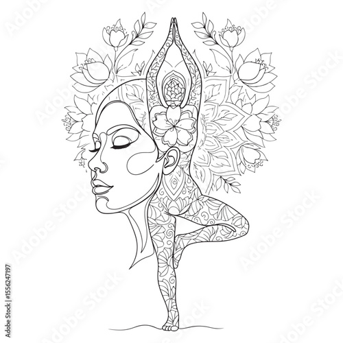 Woman in yoga tree pose with floral mandala vrikshasana