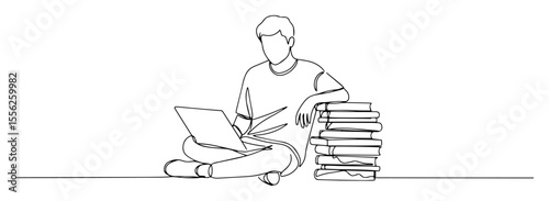 student studying with laptop and books