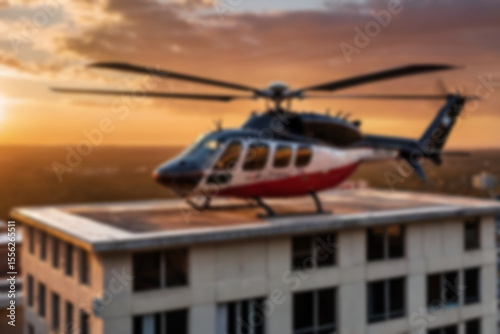 A blurry photo of a medical helicopter flying low over a city to pick up a patient.