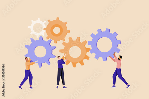 Diverse team of people working together to connect gears for a project